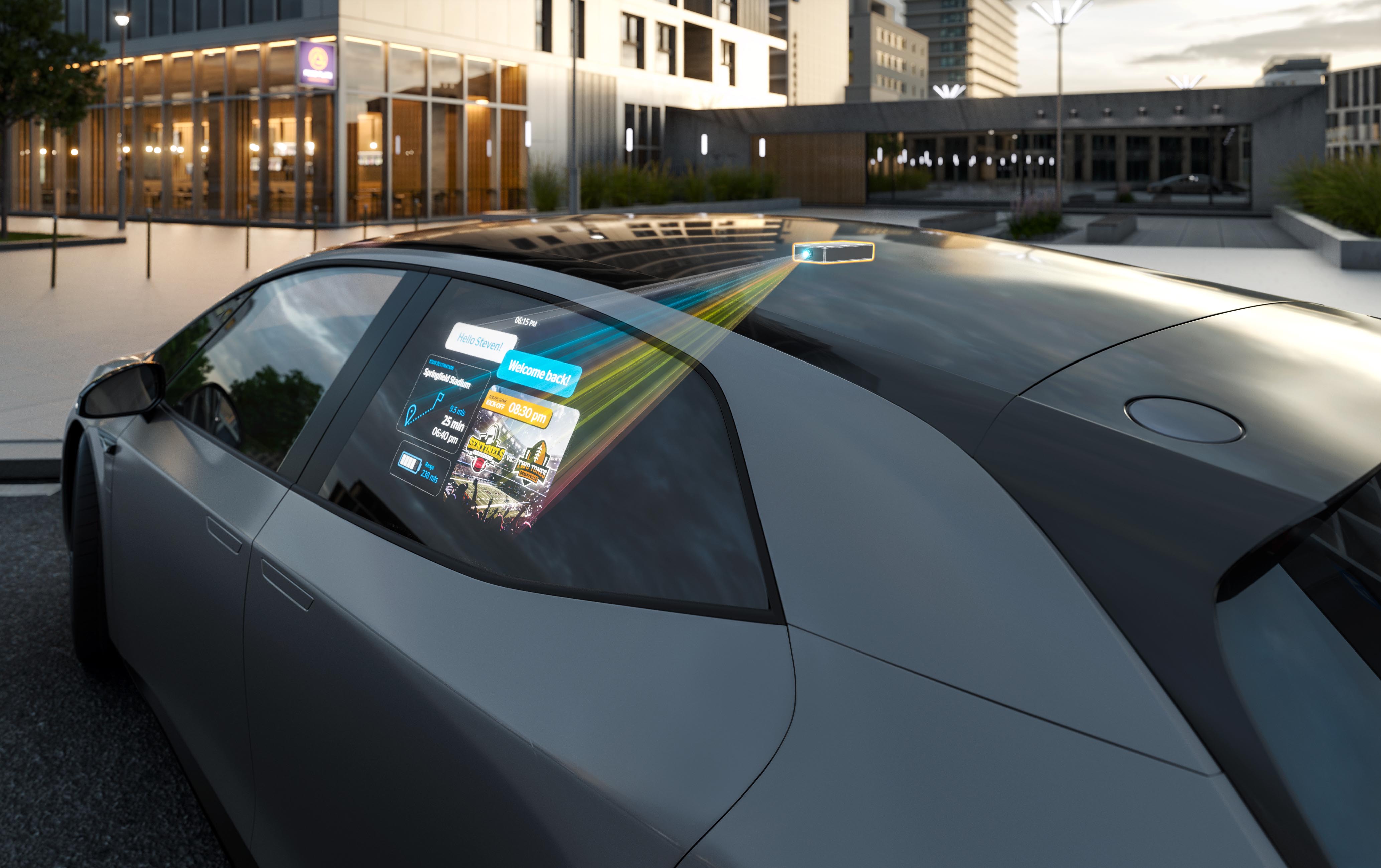 El miniproyector muestra la imagen en la ventanilla lateral del coche