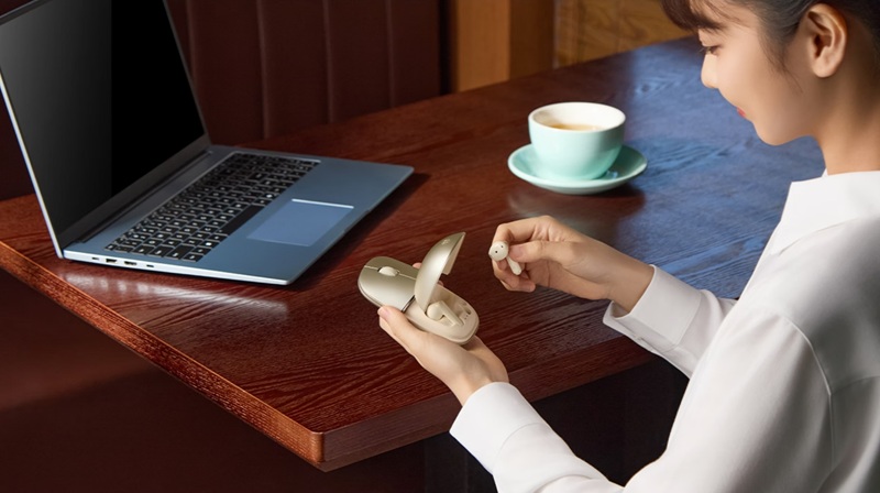 Honor MouseBuds Pro - un ratón de computadora con una estación de carga para auriculares